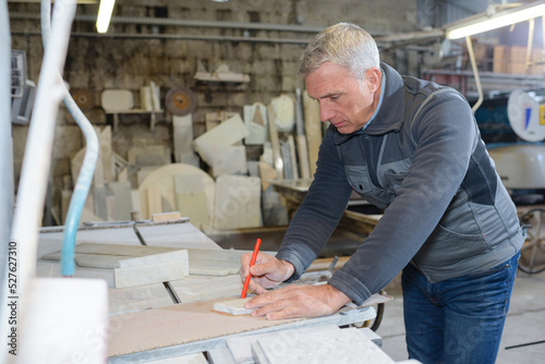 a mature carpenter at work photo