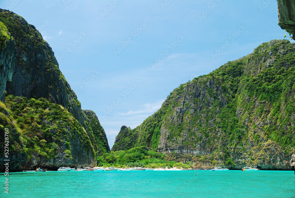 Beautiful landscape of clear blue sea with mountain in the background. The sea in the southern part of Thailand.