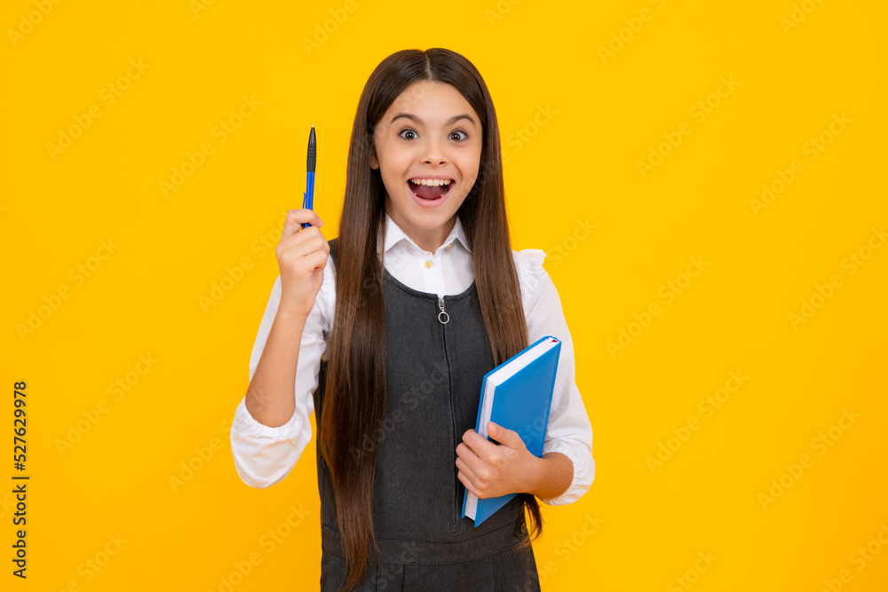 Amazed teen girl. Teen girl pupil hold books, notebooks, isolated on yellow background, copy space. Back to school, teenage lifestyle, education and knowledge. Excited expression, cheerful and glad. Amazed teen girl. Teen girl pupil hold books, notebooks, isolated on yellow background, copy space. Back to school, teenage lifestyle, education and knowledge. Excited expression, cheerful and glad.