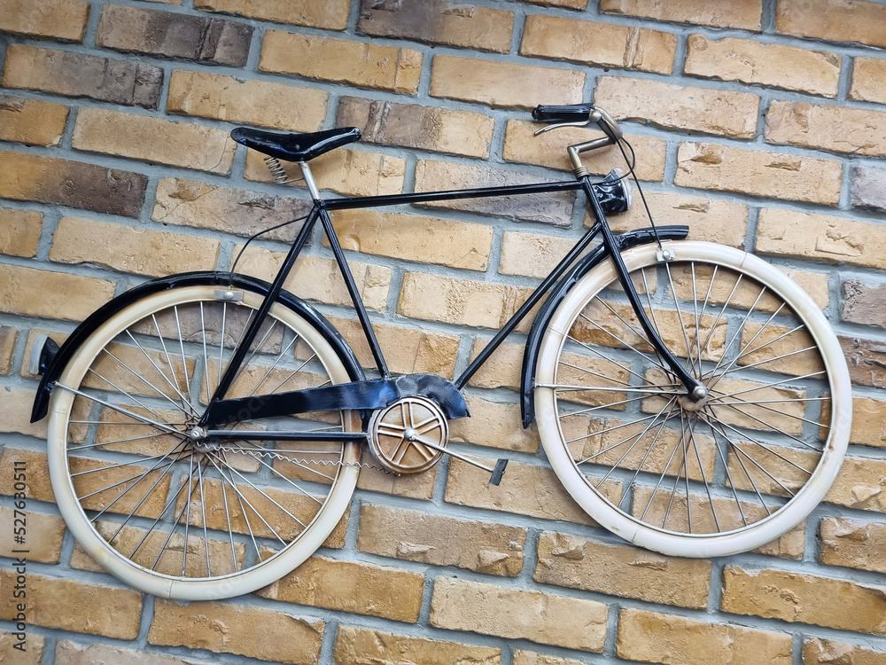 Retro bike on the background of a brick wall