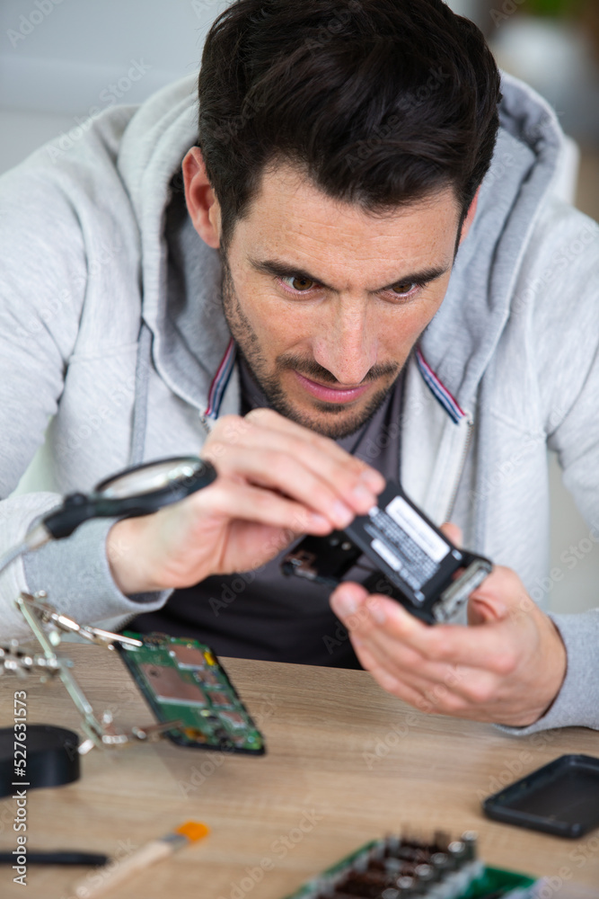 electrician working with electronical devices to the camera electrician working with electronical devices to the camera