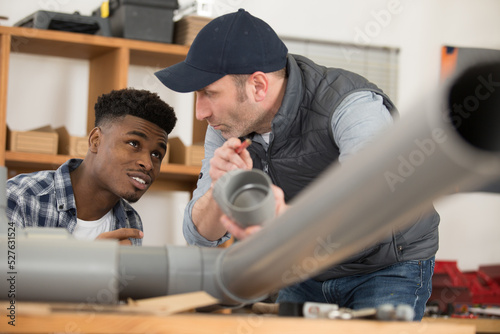 plumbers fitting pvc pipes together