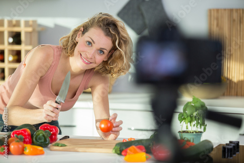 beautiful young woman filming her blog broadcast about healthy food