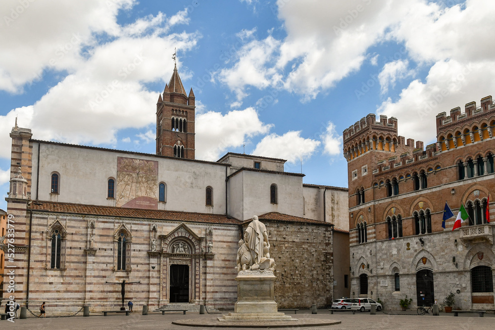Side of the Cathedral of St Lawrence and the Aldobrandeschi Palace overlooking Piazza Dante, the main square of Grosseto, Tuscany, Italy - obrazy, fototapety, plakaty 