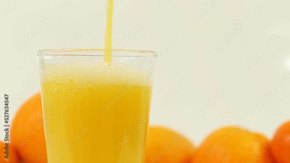 This refreshing stock photo showcases juicy oranges and freshly squeezed juice on a clean white background, perfect for health, wellness, and food-related content. This refreshing stock photo showcases juicy oranges and freshly squeezed juice on a clean white background, perfect for health, wellness, and food-related content.