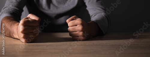 Photos Fist of angry man beats on the table