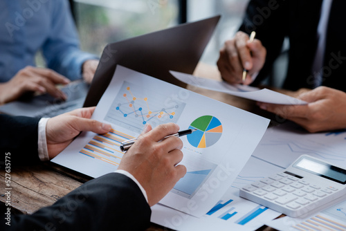 The sales department is having a monthly summary meeting to bring it to the department manager, they are verifying the correctness of the documents that are prepared before bringing in to the manager