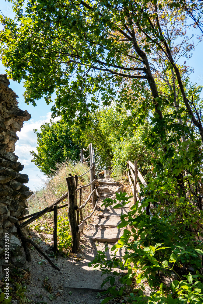 Natural staircase to the viewpoint and rest area with a bench at Vinne Castle in Slovakia for tourists Natural staircase to the viewpoint and rest area with a bench at Vinne Castle in Slovakia for tourists