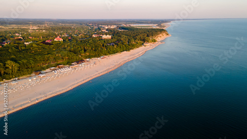 top view of the village of Yantarny in the Kaliningrad region, the Baltic Sea and the beach © Ocharonata