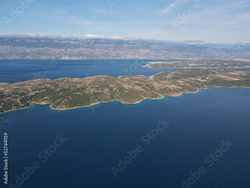 Aerial view of Potocnica, Lun and Novalja in island of Pag, archipelago of Croatia. Panoramic drone view of waterfront, idyllic and turquoise sea in Novalja, Adriatic Sea in Dalmatia region.  © AerialDronePics