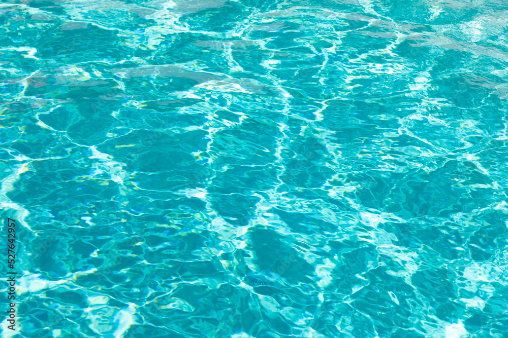 turquoise color background of swimming pool water with ripples in malibu