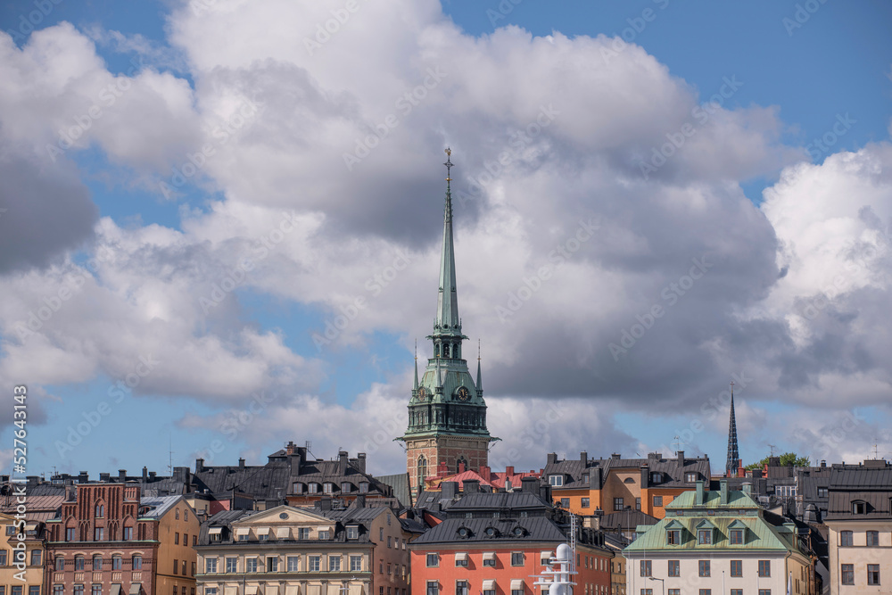 View over the old town Gamla Stan with church and towers a sunny day with cumulus clouds in Stockholm
