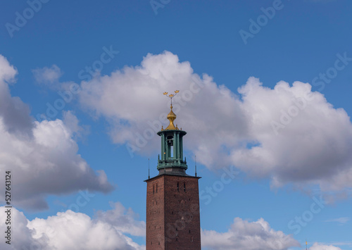 The Town City Hall tower a sunny day with cumulus clouds in Stockholm