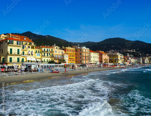 Beautiful view on a sunny day of the sea and the town of Alassio with colorful buildings, Liguria, Italian Riviera, region San Remo, Cote d'Azur, Italy