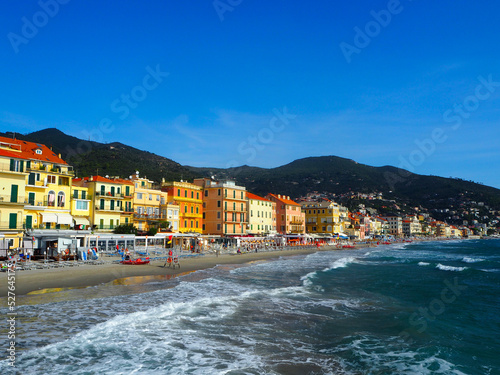 Beautiful view on a sunny day of the sea and the town of Alassio with colorful buildings, Liguria, Italian Riviera, region San Remo, Cote d'Azur, Italy