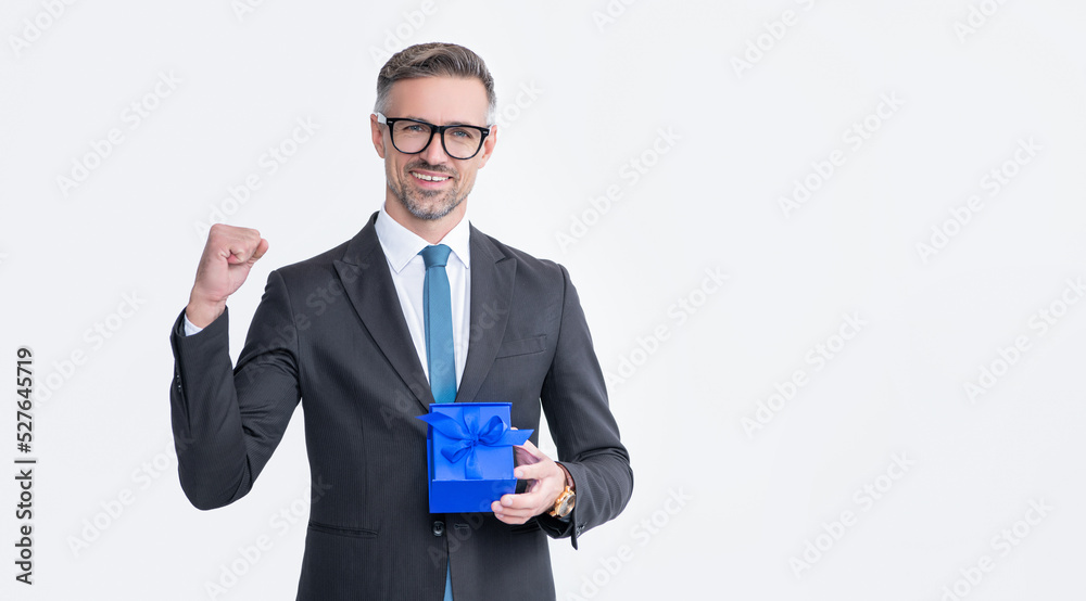 successful mature man in eyeglasses and suit hold present box isolated on white background successful mature man in eyeglasses and suit hold present box isolated on white background