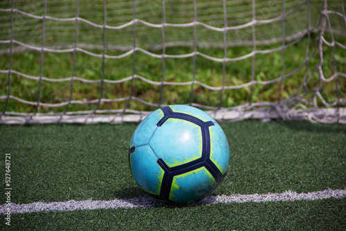 a soccer ball lies on the goal line on the grass © Александр Переверзев
