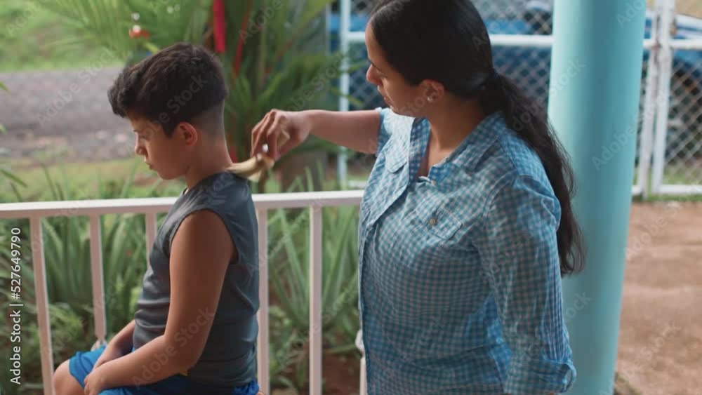latina mom cutting her hair, removing her hair with hair cleaner, medium flat latina mom cutting her hair, removing her hair with hair cleaner, medium flat