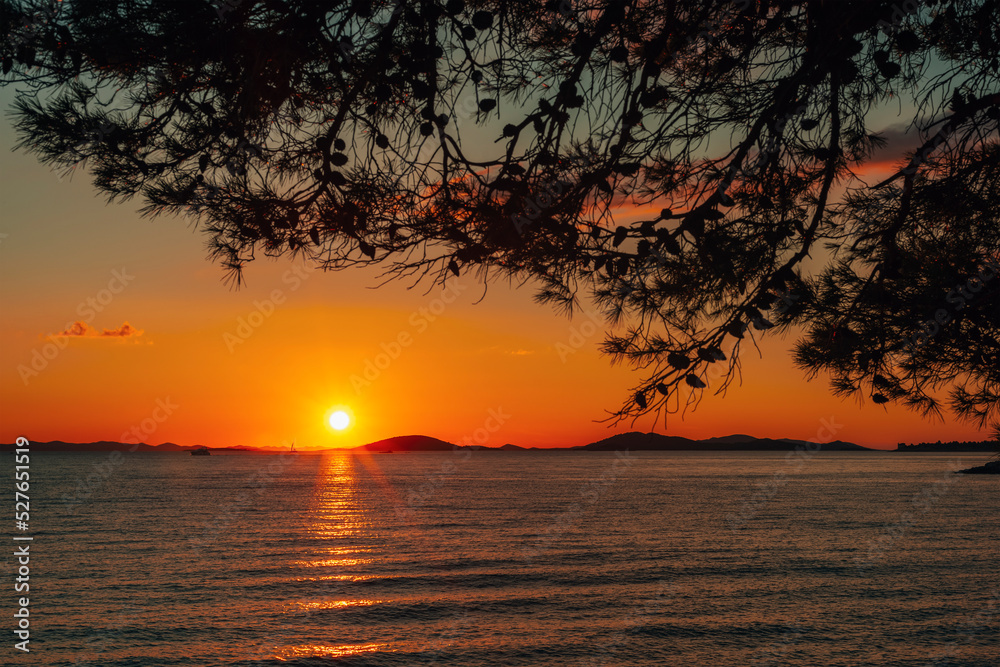 Scenic orange sunset on the sea, Adriatic, Croatia Scenic orange sunset on the sea, Adriatic, Croatia