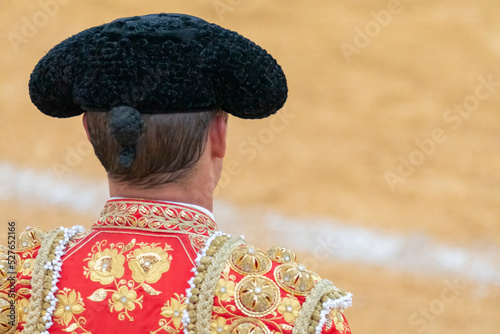 Close-up of a bullfighter looking into the arena and waiting