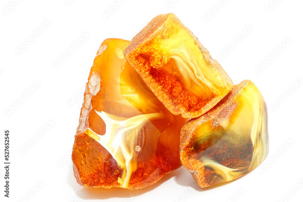 Amber with patterns on a white background. landscape mineral. Sun stone. Jewelry material. Natural beauty. Fossil fossilized resin. Copal. Landscape. patterns. Play of light. Crystal Amber with patterns on a white background. landscape mineral. Sun stone. Jewelry material. Natural beauty. Fossil fossilized resin. Copal. Landscape. patterns. Play of light. Crystal