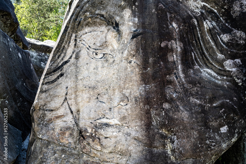 Face wall painting on boulder in Fontainbelau. photo