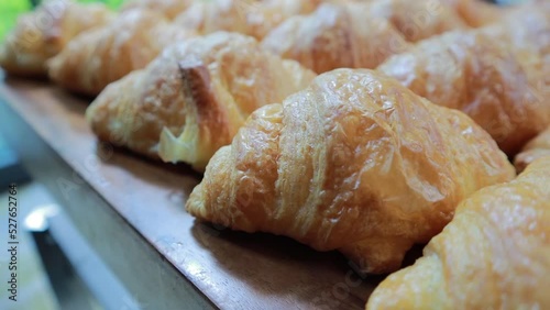 Close up on Fresh Crunchy croissants on wood plate