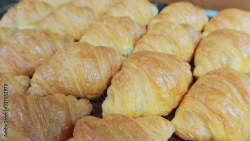 Close up on Fresh Crunchy croissants on wood plate