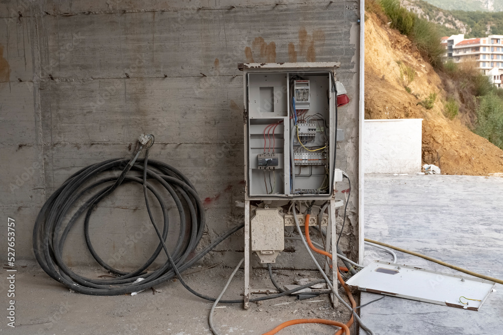 An electrical distributor attached to the concrete base of an