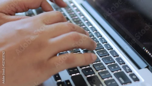 Person Typing on the Computer Keyboard. Working, Writing Emails, Using Internet. Notebook lying on the Table. Software, online education, apps, modern tech concept