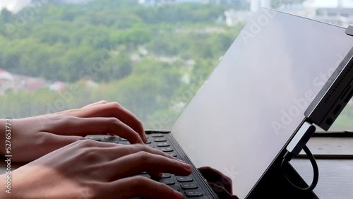 Person Typing on the Computer Keyboard. Working, Writing Emails, Using Internet. Notebook lying on the Table. Software, online education, apps, modern tech concept