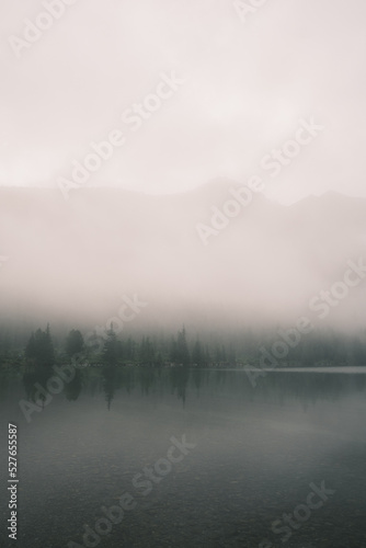 Beautiful mystical landscape of Altai Lake in the fog. Theme of relaxation and zen buddhism. Minimalism concept.