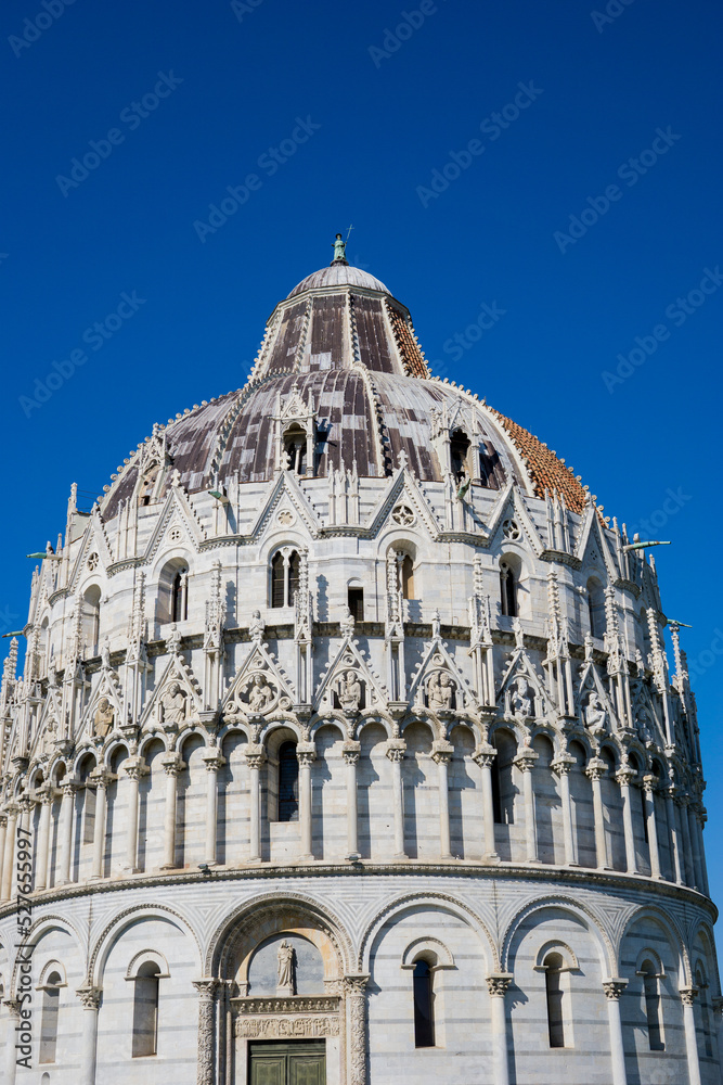 Pisa, Tuscany, Italy 08-28-2022. Details the architecture of the Pisa Baptistery, dedicated to Saint John the Baptist, faces the cathedral at the western end of the Piazza dei Miracoli.