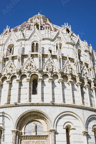Pisa, Tuscany, Italy 08-28-2022. Details the architecture of the Pisa Baptistery, dedicated to Saint John the Baptist, faces the cathedral at the western end of the Piazza dei Miracoli.