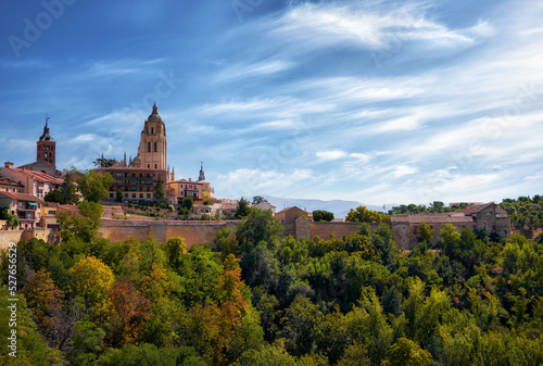 View of the cathedral of segovia with a large park and summer weather.