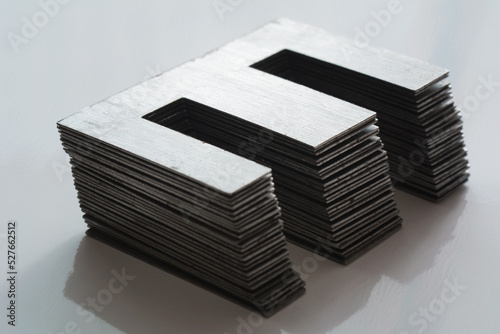 Ferromagnetic metal core for high energy efficient transformer. Ferrite transformer for switching power supply. Selective focus, shallow depth of field.