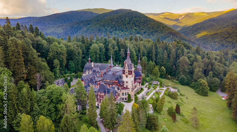 Aerial photography of Peles Castle in Romania. Photography was shot from a drone at a higher altitude with camera pointed downwards towards the castle.