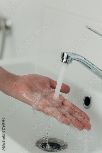 The Girl Washes Her Hands to Avoid Infection With the Virus COVID-19