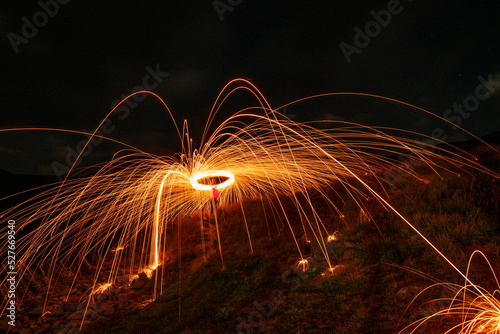 Fireworks in the night. Long exposure night photography with steel wool effects.