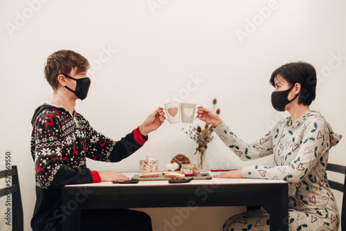 Girl and Guy on Quarantine Drinking Coffee in Masks