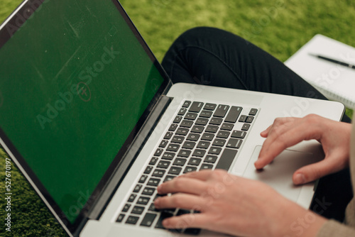 Close-Up Shot of Human Hands Placed Over Laptop