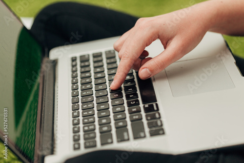 Close-Up Shot of Human Hands Placed Over Laptop