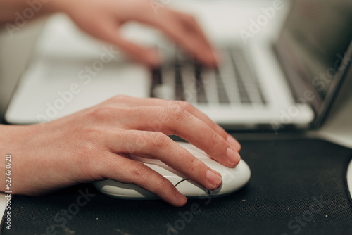Close-Up Shot of Human Hands Placed Over Laptop