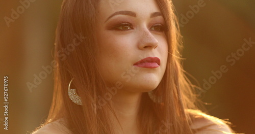 Contemplative pretty girl looking at the hirozon thinking about life. Pensive young woman in meditation and contemplation during sunset photo