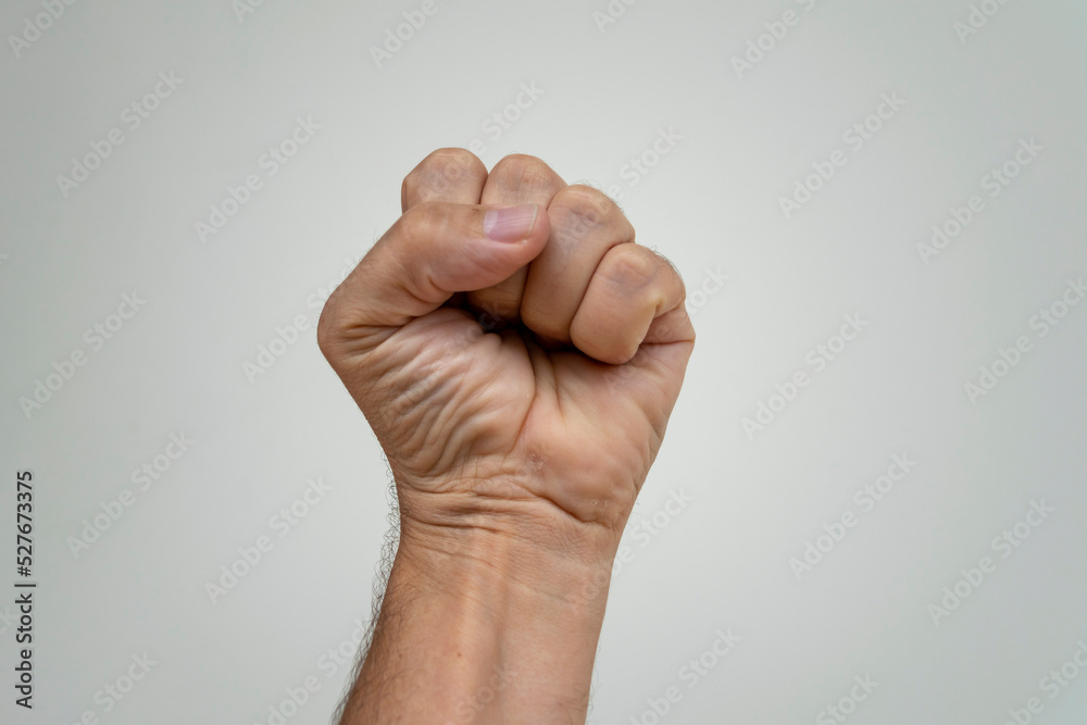 Clenched fist on white background. hand with closed fist. symbol of claw, strength and fight Clenched fist on white background. hand with closed fist. symbol of claw, strength and fight