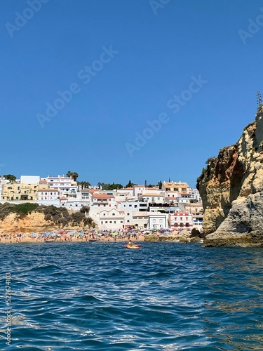 A view of beautiful sandy beach in Armacao de Pera seaside town, Algarve region, Portugal. View from a boat.