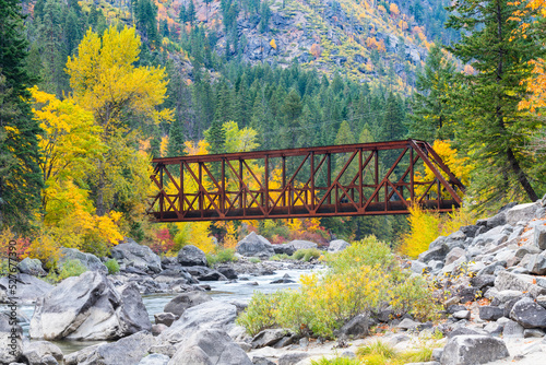 Tumwater Canyon Bridge in fall crossing the boulder strewn Wenatchee River photo