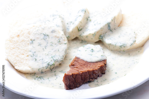 beef meat with dill sauce and dumplings