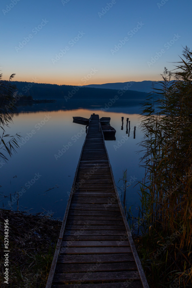 Obraz premium fishing boat at pier on Jenoi pond near Diosjeno, Northern Hungary