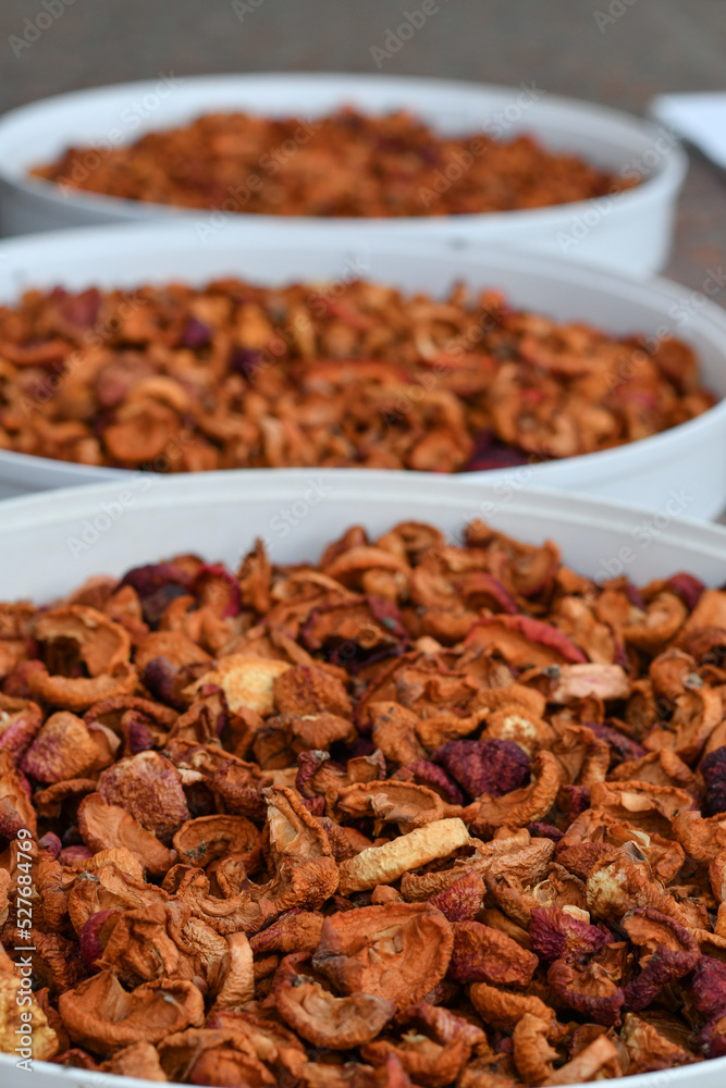 Ready dried apple slices stored in the sacks. Selective focus. Ready dried apple slices stored in the sacks. Selective focus.